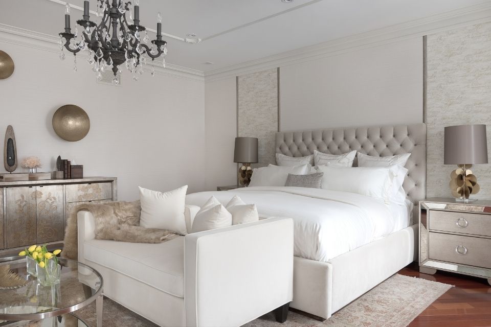 White bedroom design by Diana Rose Balanyuk with chic chandelier